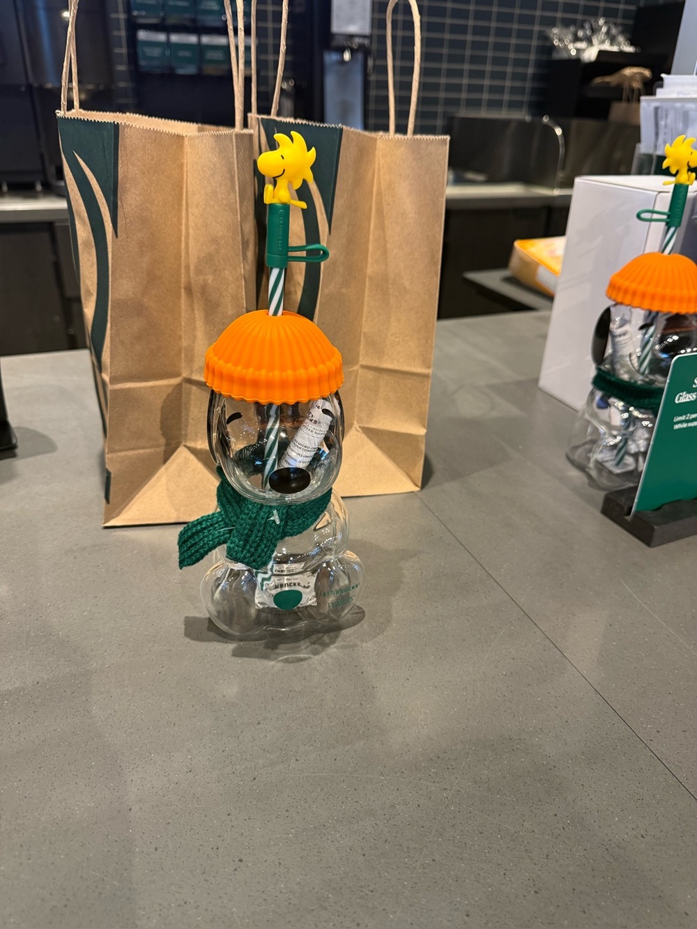 Clear Bear-shaped Drink Cup with Orange Lid and Green Straw